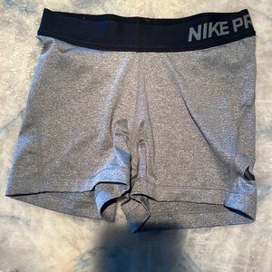 Gray and black Nike pro small